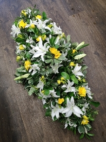 Lily and yellow Freesia Casket Spray