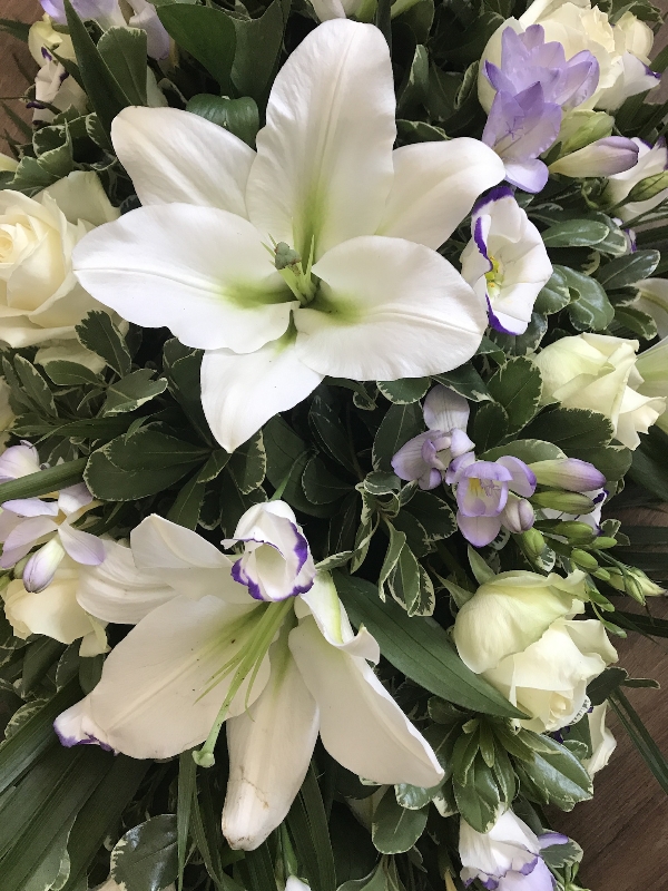 Lily and lilac casket spray