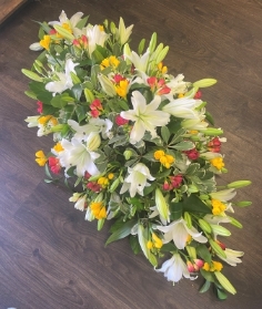 Lily and mixed freesias casket spray