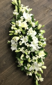 Lily and white Freesia casket spray