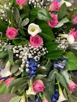 Pink white and blue casket spray