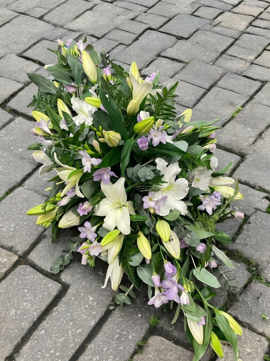 Lily and lilac casket spray